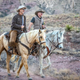 Jeff and Mark Bezos, on horseback.